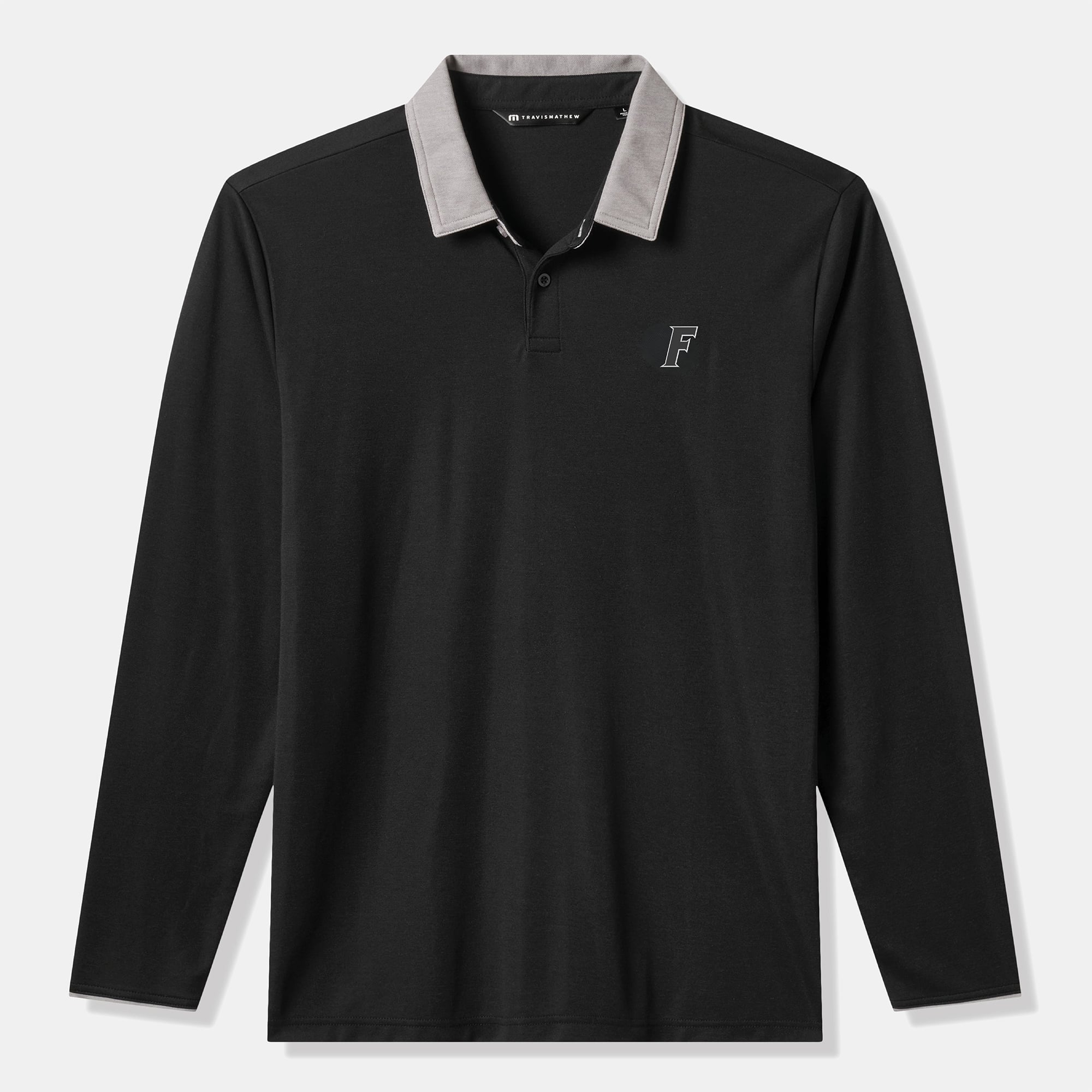 Polo TravisMathew noir vintage à manches longues pour homme, style universitaire Florida Gators, en mélange de trois matières.